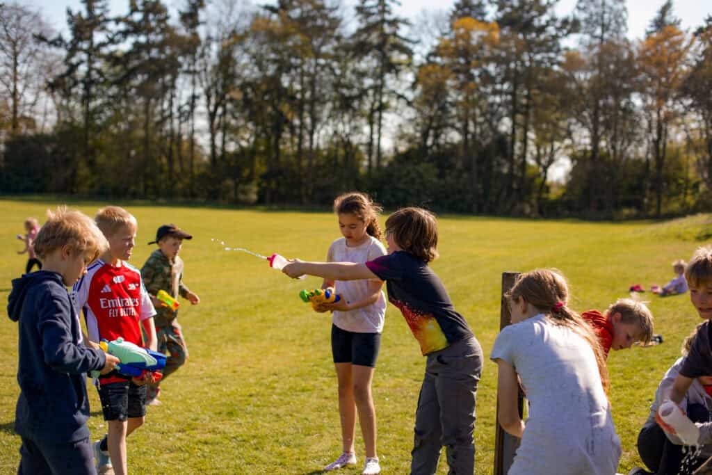 A group of energetic kids splashing and playing with water under the bright summer sun at Educamps — the perfect way to stay cool and hydrated during a day full of outdoor adventure. Laughter fills the air as they enjoy fun, refreshing activities that keep them active, safe, and smiling all day long.