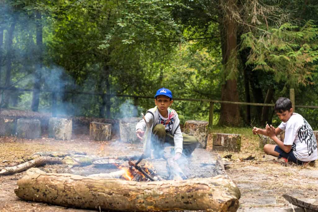 Children taking part in a campfire/bushcraft exercise on an Educamps Adventures 3 Day Summer Camp