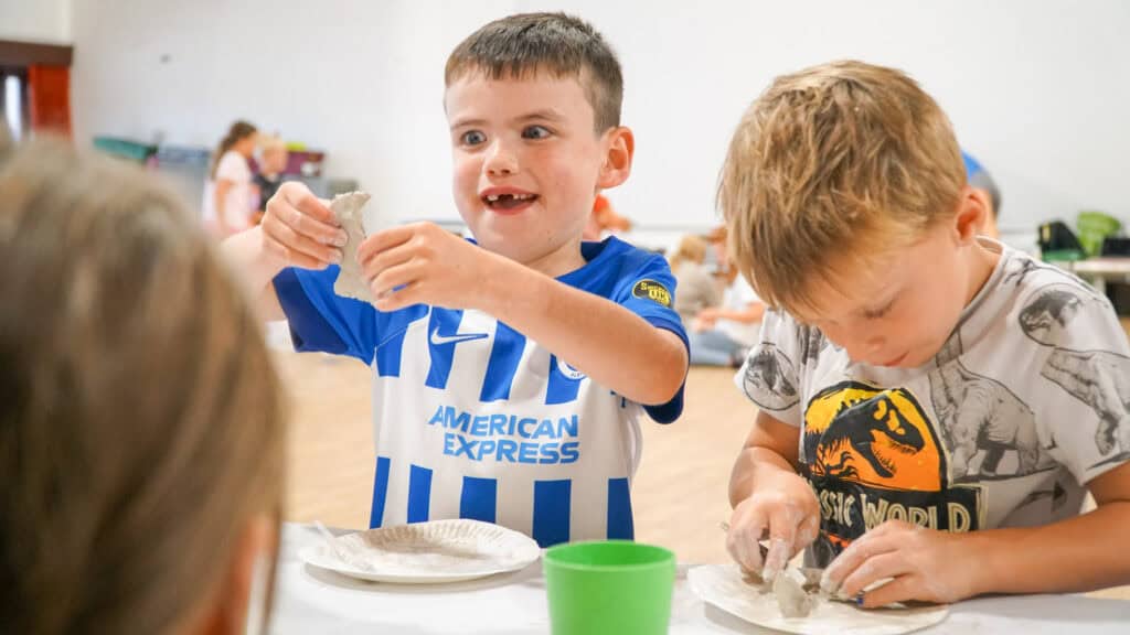 Children enjoying creative clay and craft activities during Educamps Inset Day at Sopley Primary School