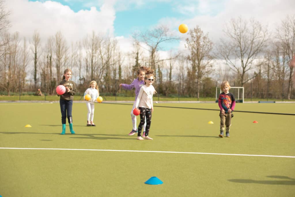 Kids enjoying a fun and energetic dodgeball game at Educamps Inset Day Camp in the New Forest